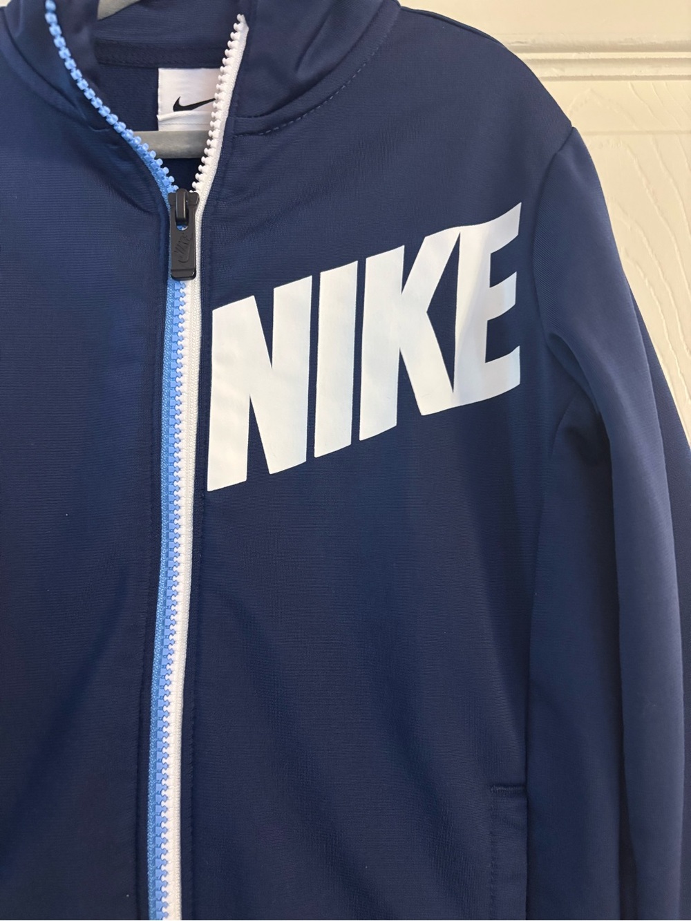 Nike Navy Jacket with White Logo and Light Blue Trim - Picture 2 of 3